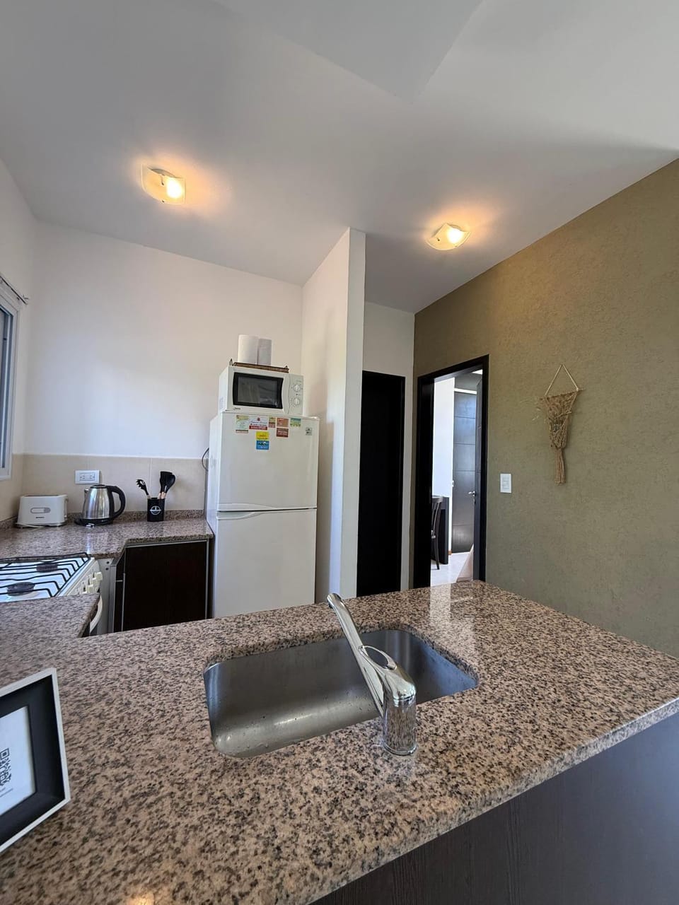 Kitchen or kitchenette, oven, stove, toaster