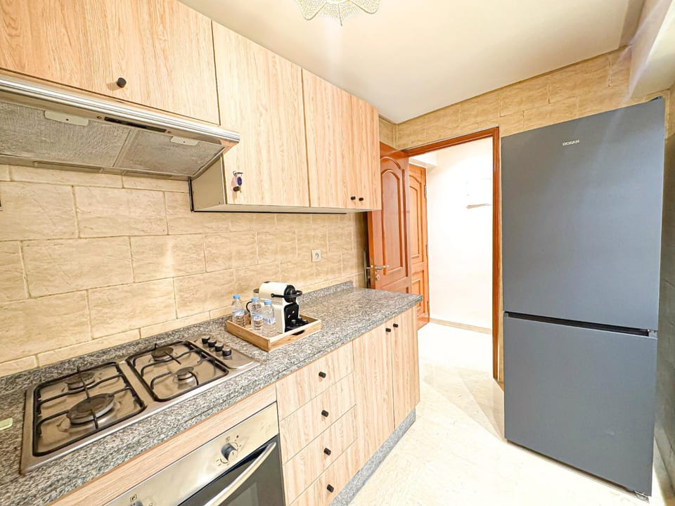 Kitchen or kitchenette, dishwasher, oven, stove