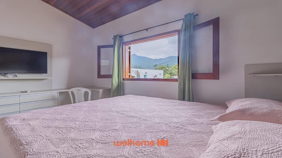 Casa em Ubatuba com churrasqueira e varanda ampla House in Ubatuba