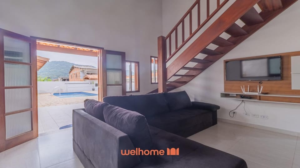 Casa em Ubatuba com churrasqueira e varanda ampla House in Ubatuba