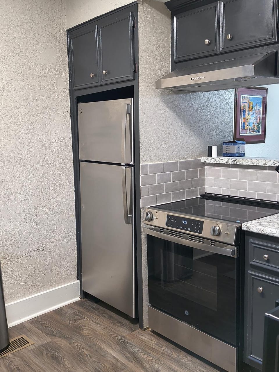 Kitchen or kitchenette, dishwasher, oven, stove
