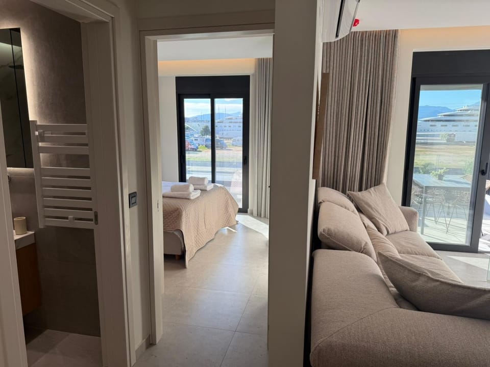 Bed, Bathroom, Living room, Seating area, Bedroom