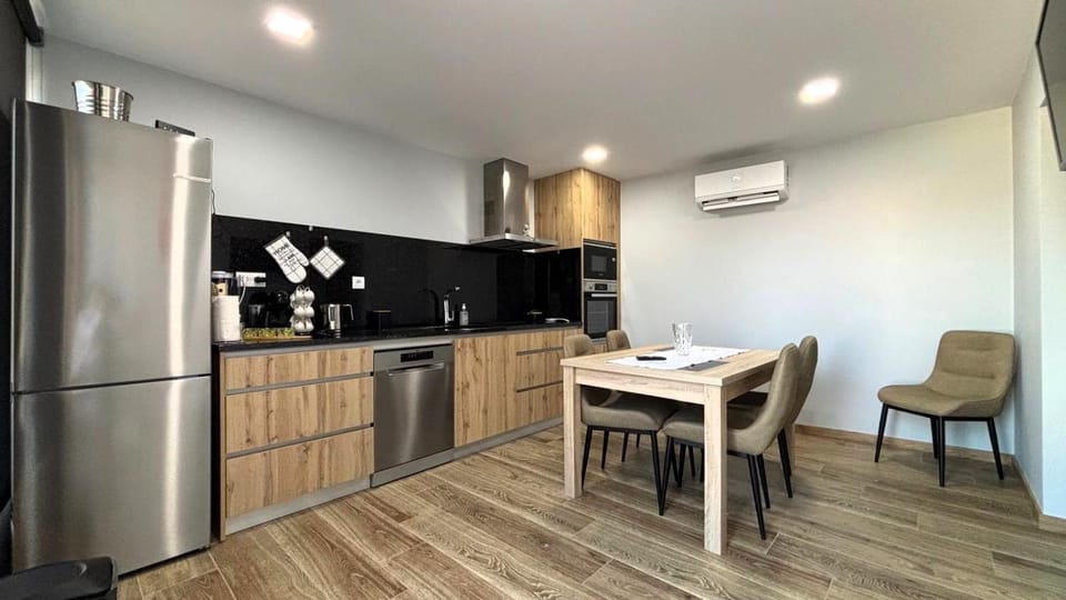 Kitchen or kitchenette, Dining area, dishwasher, oven, stove, air conditioner