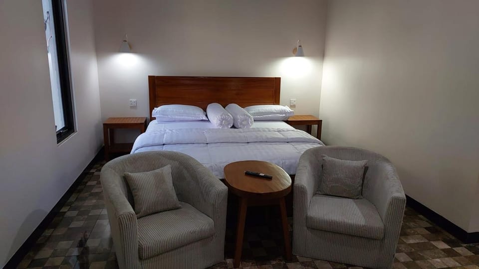 Bed, Living room, Seating area, Bedroom