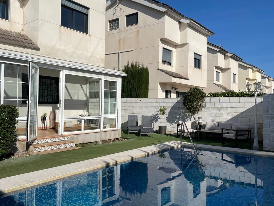 Property building, Patio, Day, Summer, Garden, Seating area, Pool view, Swimming pool, sunbed