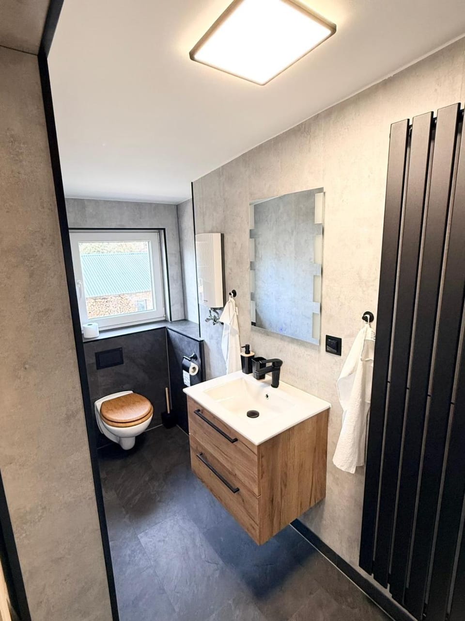 Toilet, Bathroom, hair dryier, towels