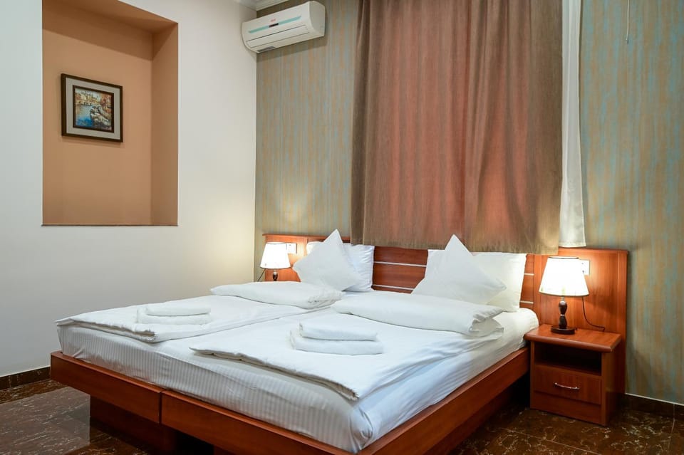 Bed, Photo of the whole room, Bedroom, towels, air conditioner