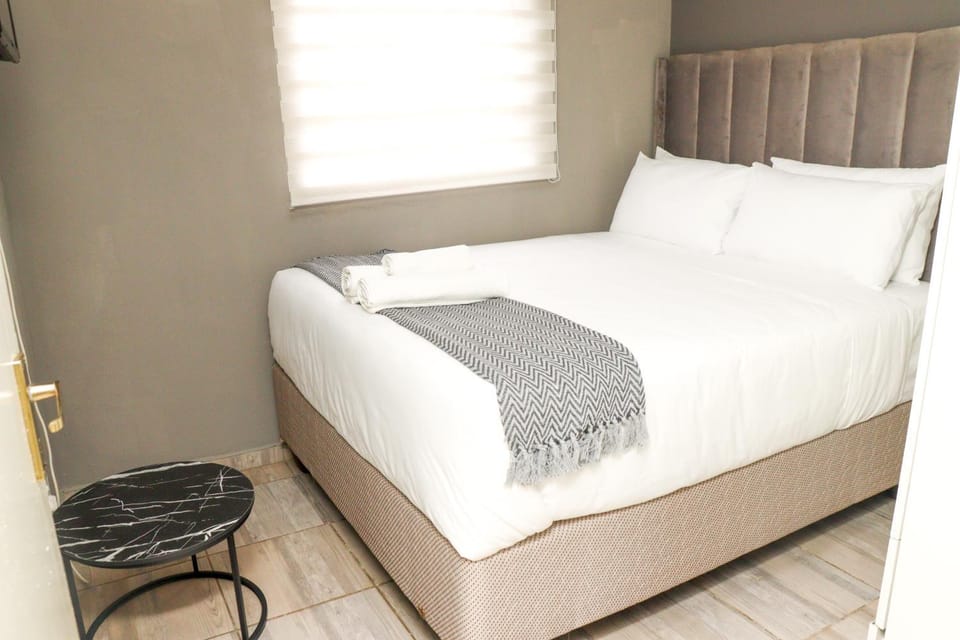 Bed, towels, wardrobe