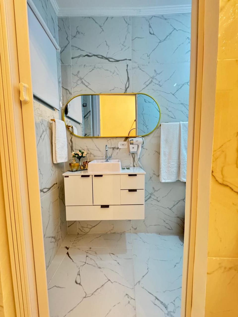 Bathroom, hair dryier, towels
