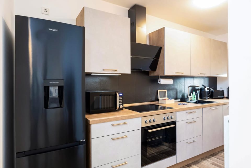 Kitchen or kitchenette, dishwasher, oven, stove, toaster