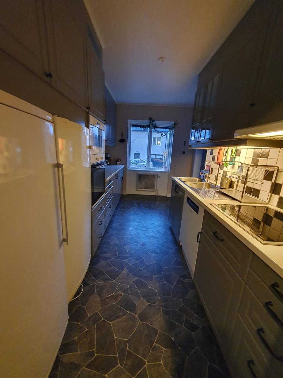 Kitchen or kitchenette, dishwasher, oven, stove
