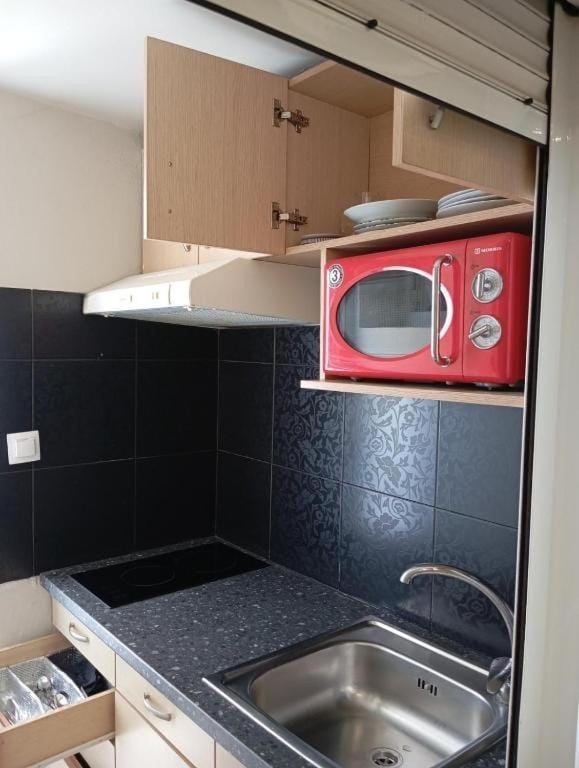 Kitchen or kitchenette, stove