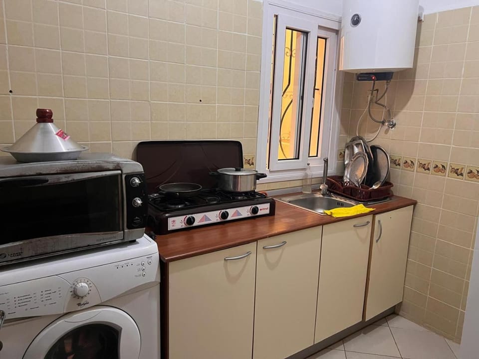 Kitchen or kitchenette, dishwasher, stove, washing machine