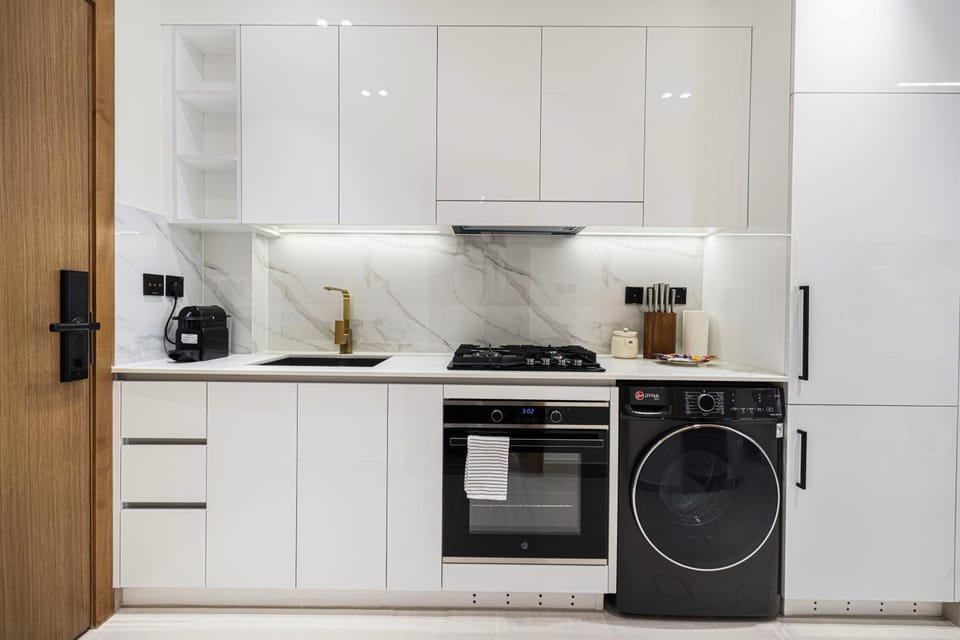 Kitchen or kitchenette, oven, stove, washing machine