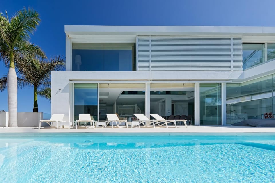 Property building, Patio, Pool view, Swimming pool, sunbed