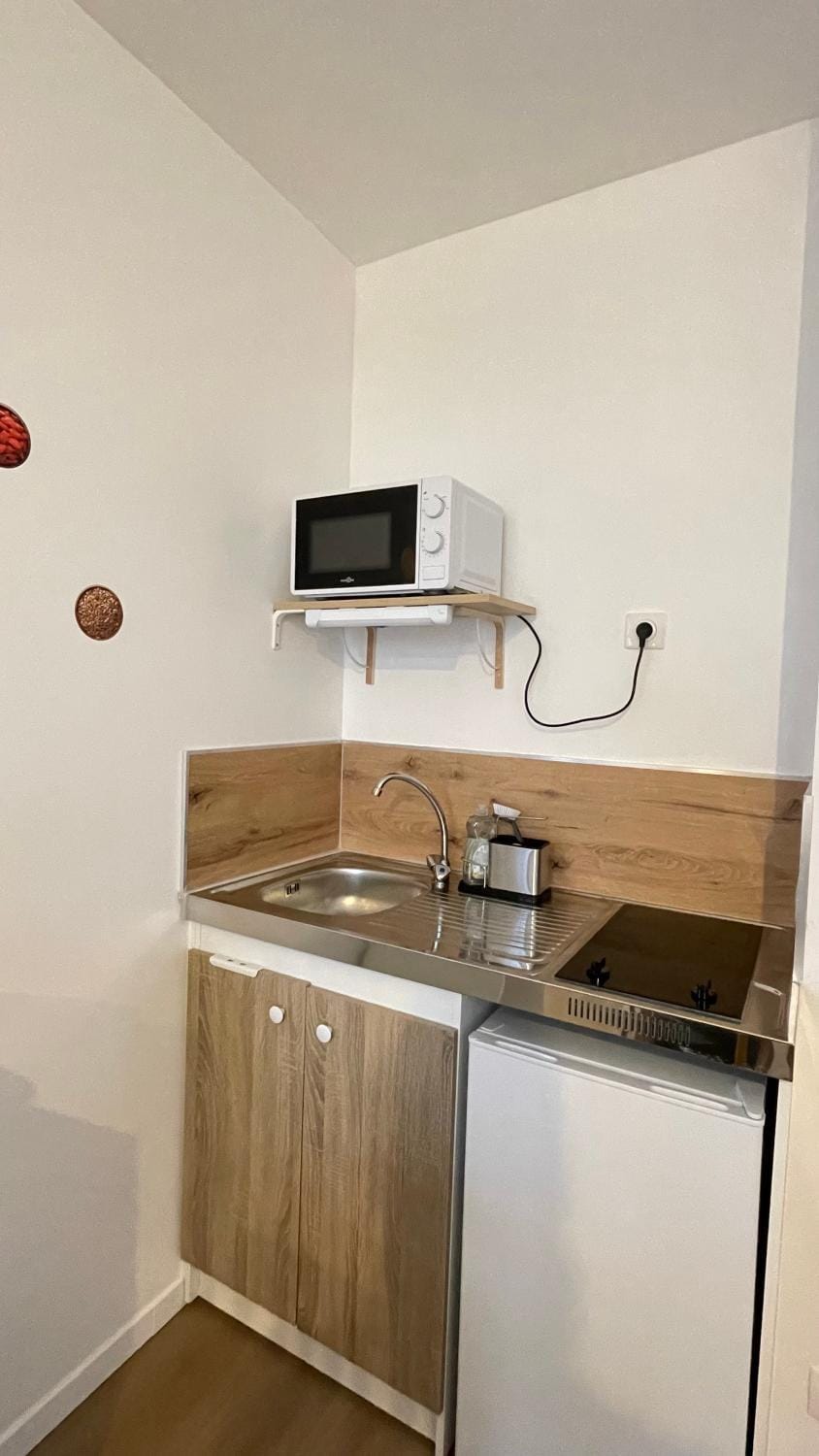 Kitchen or kitchenette, microwave
