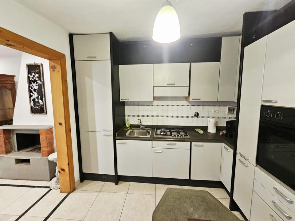 Kitchen or kitchenette, dishwasher, oven, stove