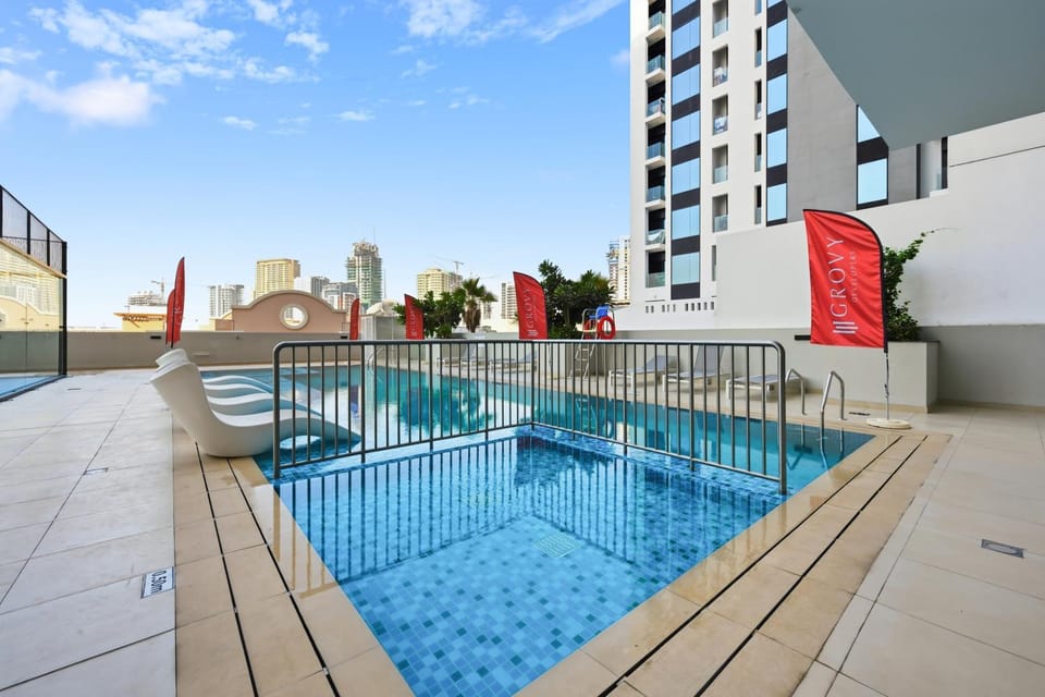 Property building, Day, Pool view, Swimming pool, sunbed