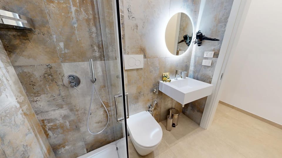 Toilet, Bathroom, hair dryier, towels