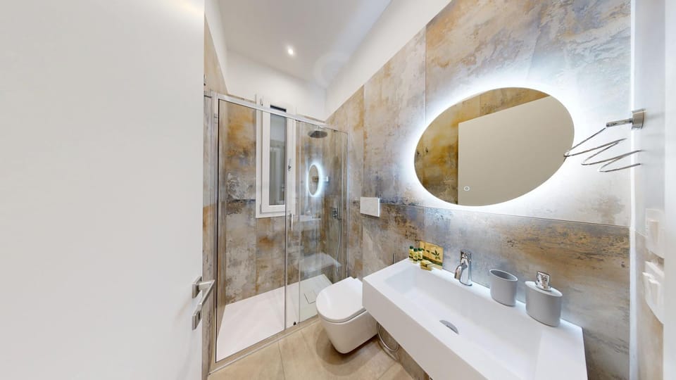 Shower, Toilet, Bathroom, hair dryier, towels