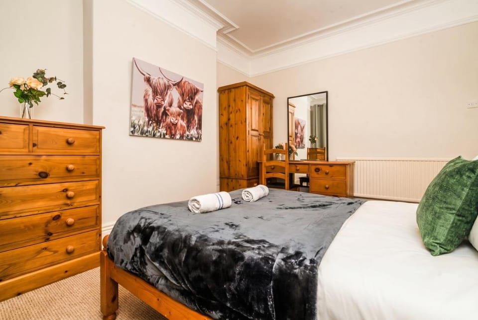 Bed, Decorative detail, Seating area, Bedroom, towels, wardrobe