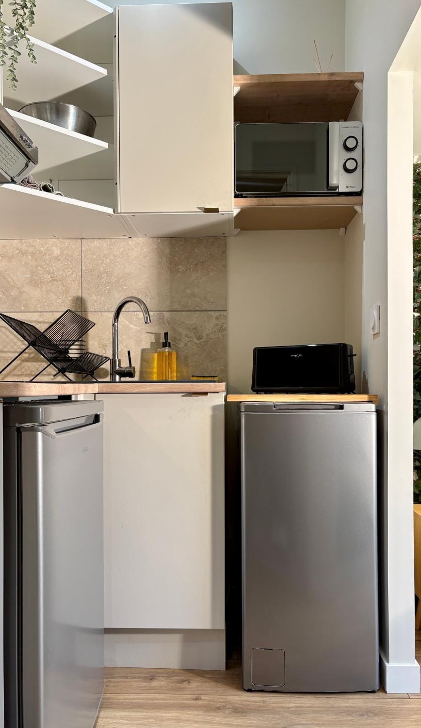 Kitchen or kitchenette, microwave, storage, stove, toaster, kitchen