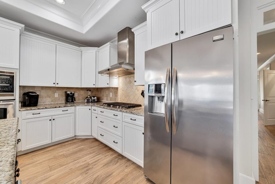 Kitchen or kitchenette, dishwasher, oven, stove, toaster