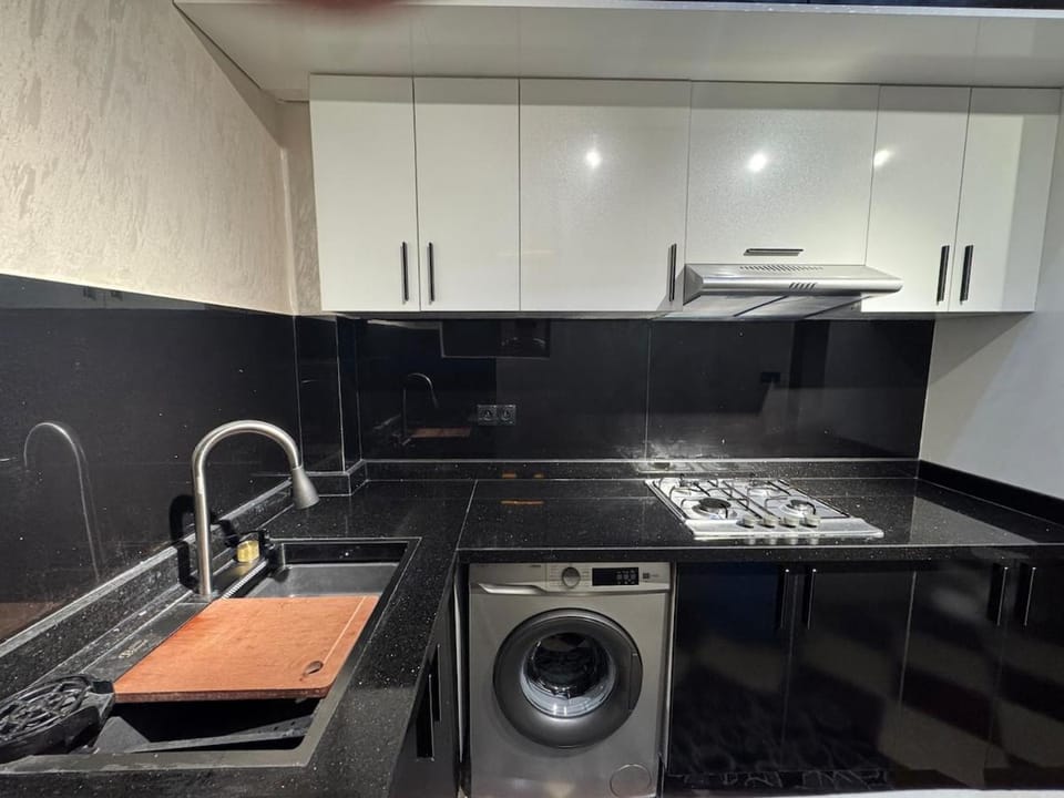 Kitchen or kitchenette, stove, washing machine