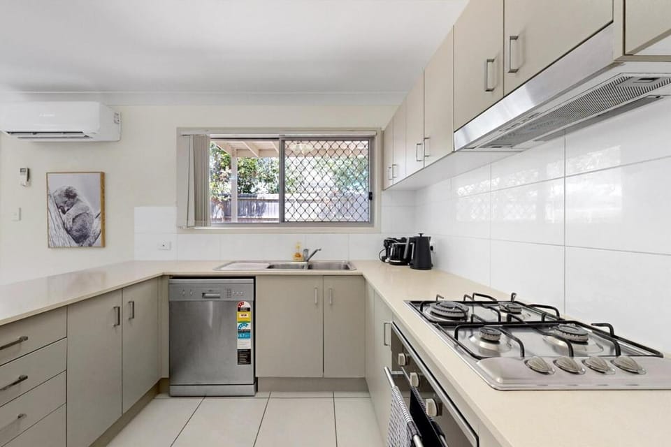 Kitchen or kitchenette, dishwasher, oven, stove, toaster