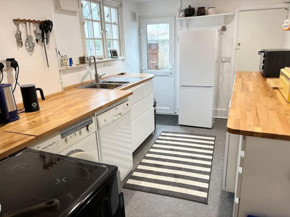 Kitchen or kitchenette, dishwasher, oven, stove, toaster