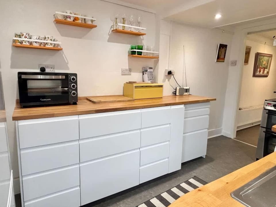 Kitchen or kitchenette, stove, toaster