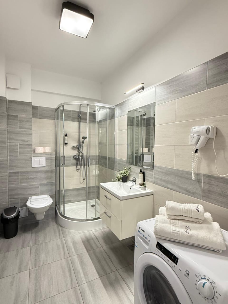 Shower, Toilet, Bathroom, towels, washing machine, dryer