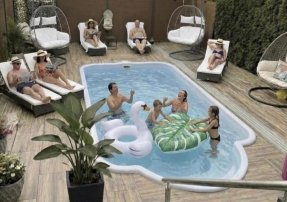 Pool view, Swimming pool, group of guests, sunbed