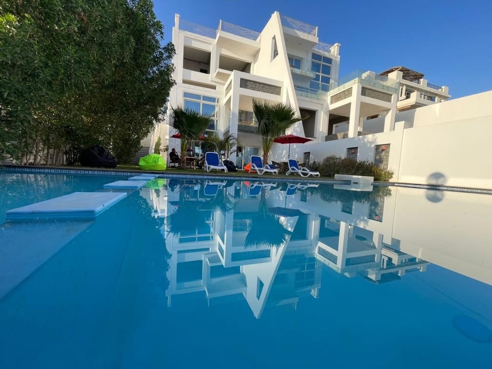 Property building, Pool view, Swimming pool, sunbed
