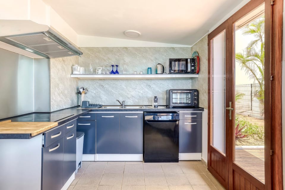 Kitchen or kitchenette, dishwasher, oven, stove