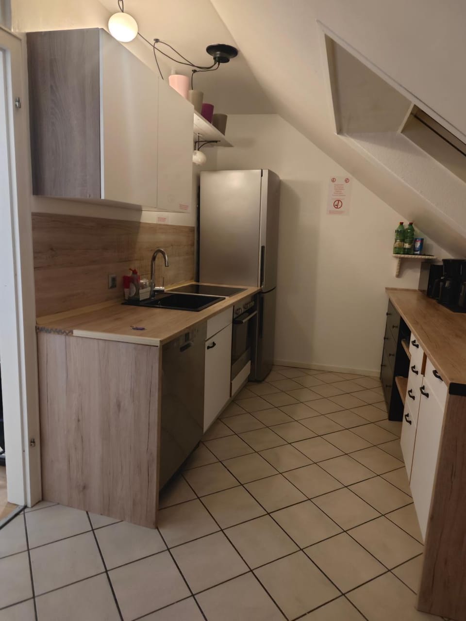 Kitchen or kitchenette, dishwasher, oven, stove