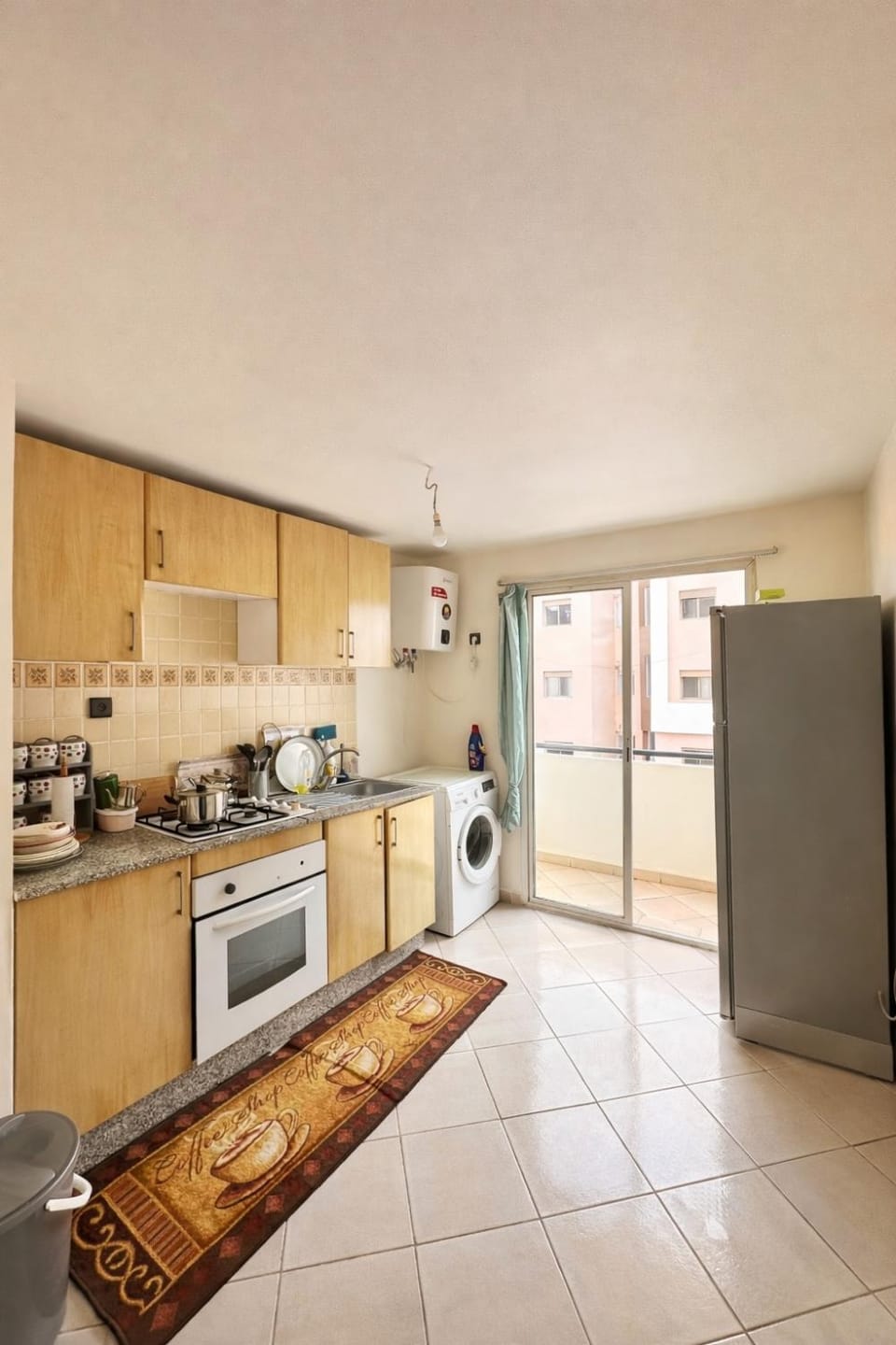 Kitchen or kitchenette, dishwasher, oven, stove, washing machine, dryer
