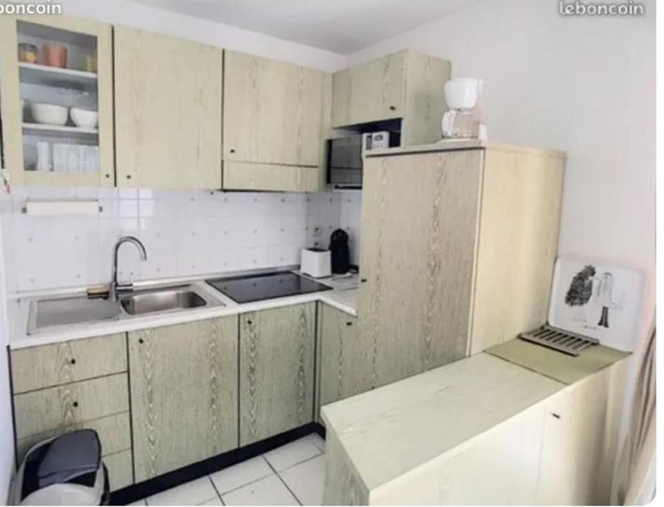 Kitchen or kitchenette, dishwasher, oven, stove, toaster