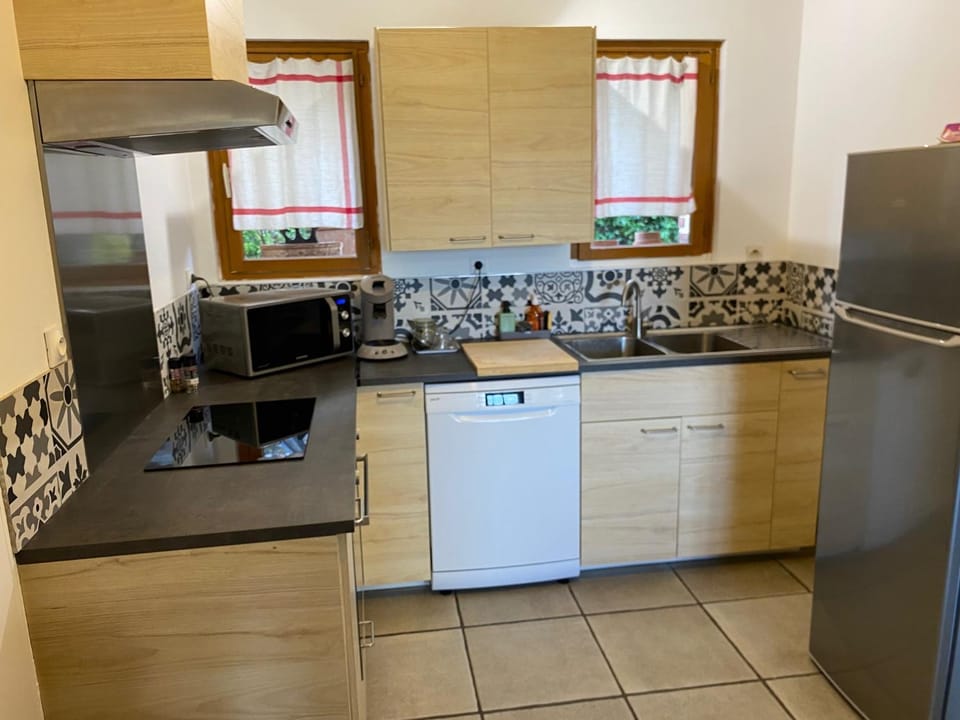 Kitchen or kitchenette, dishwasher, oven, stove