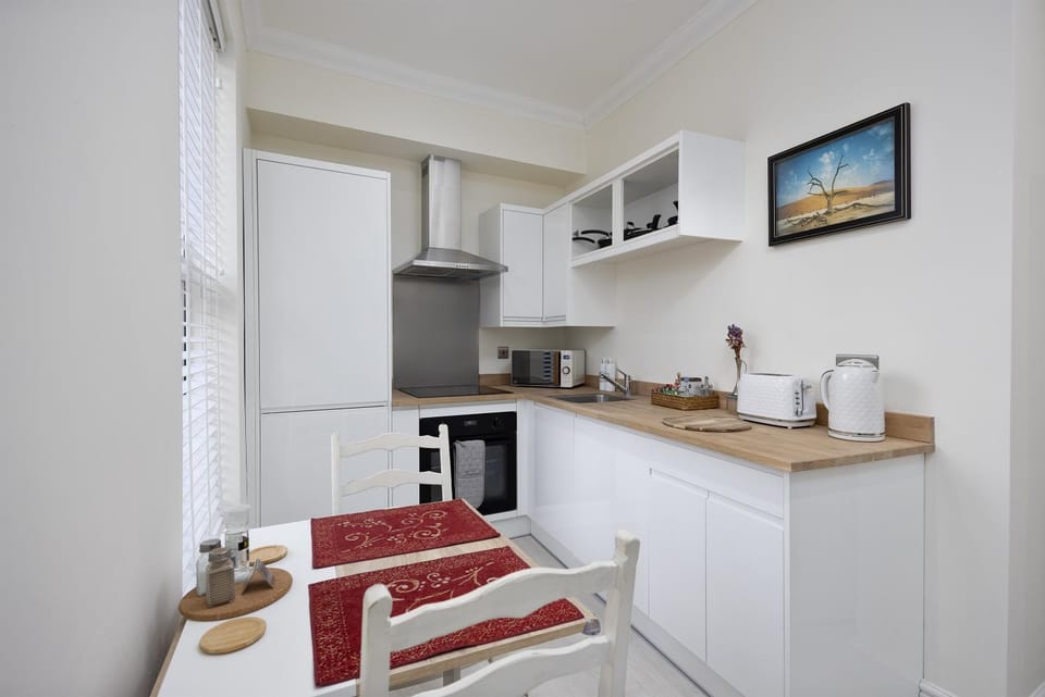Kitchen or kitchenette, Dining area, dishwasher, oven, stove, toaster