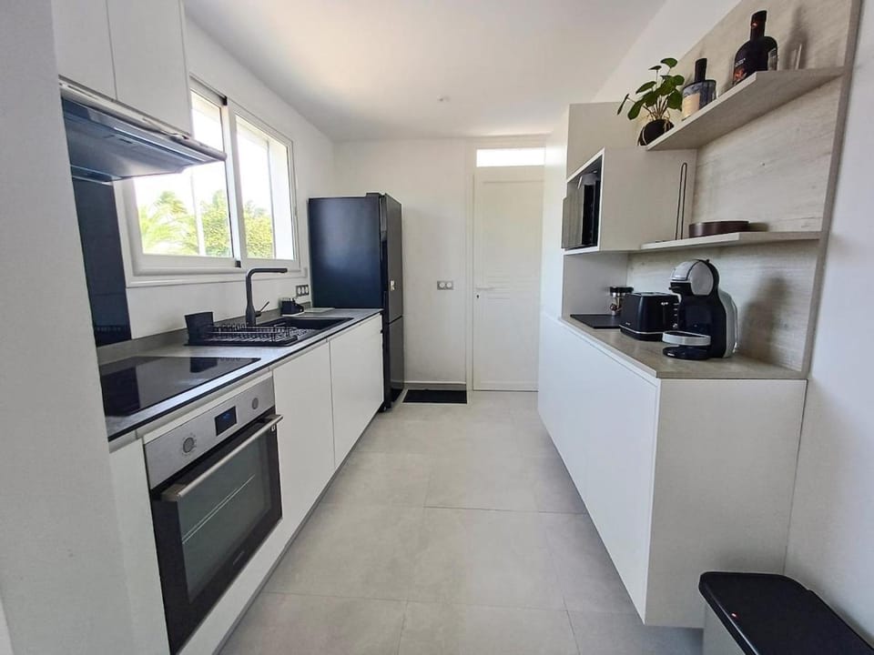 Kitchen or kitchenette, dishwasher, oven, stove, toaster