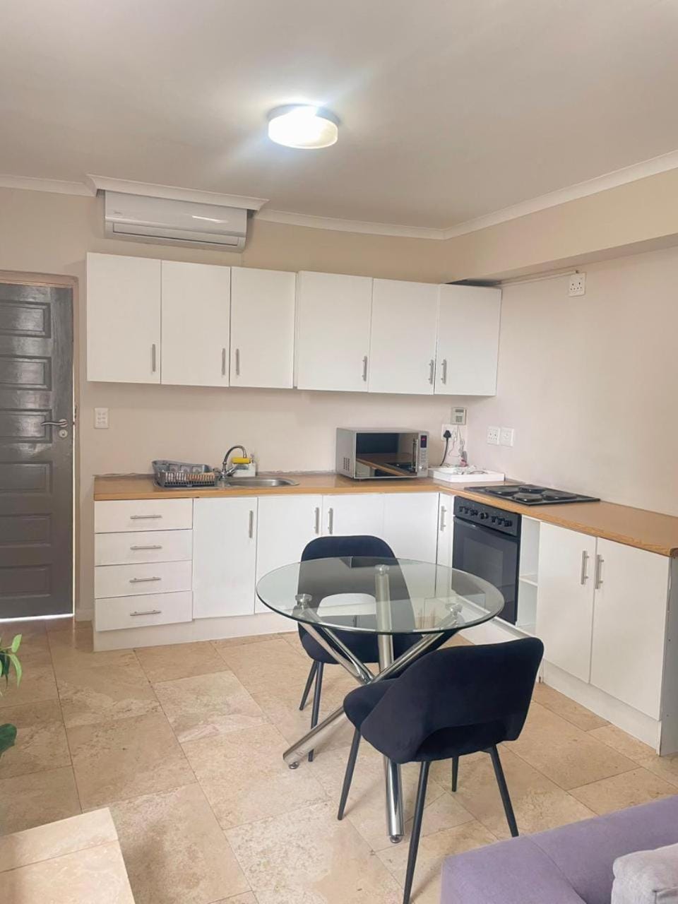 Kitchen or kitchenette, Dining area, microwave, oven, air conditioner