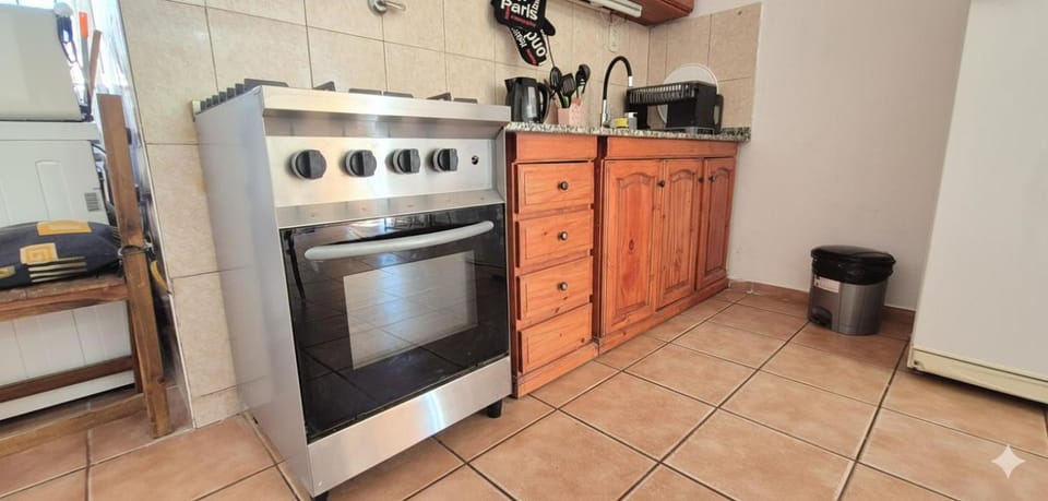 Kitchen or kitchenette, dishwasher, oven, washing machine