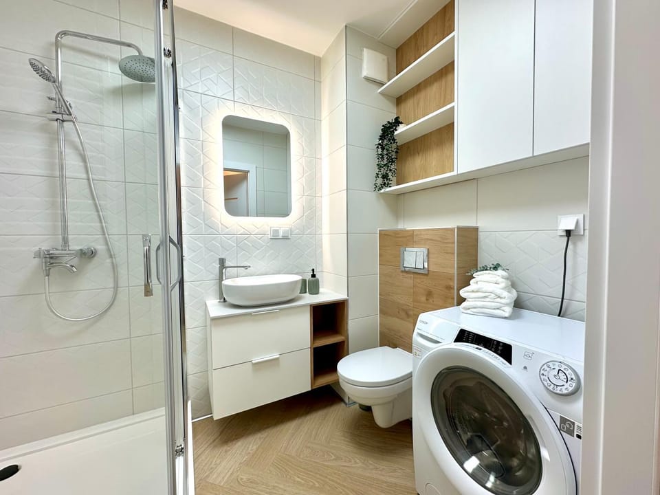 Shower, Toilet, Bathroom, towels, washing machine, dryer