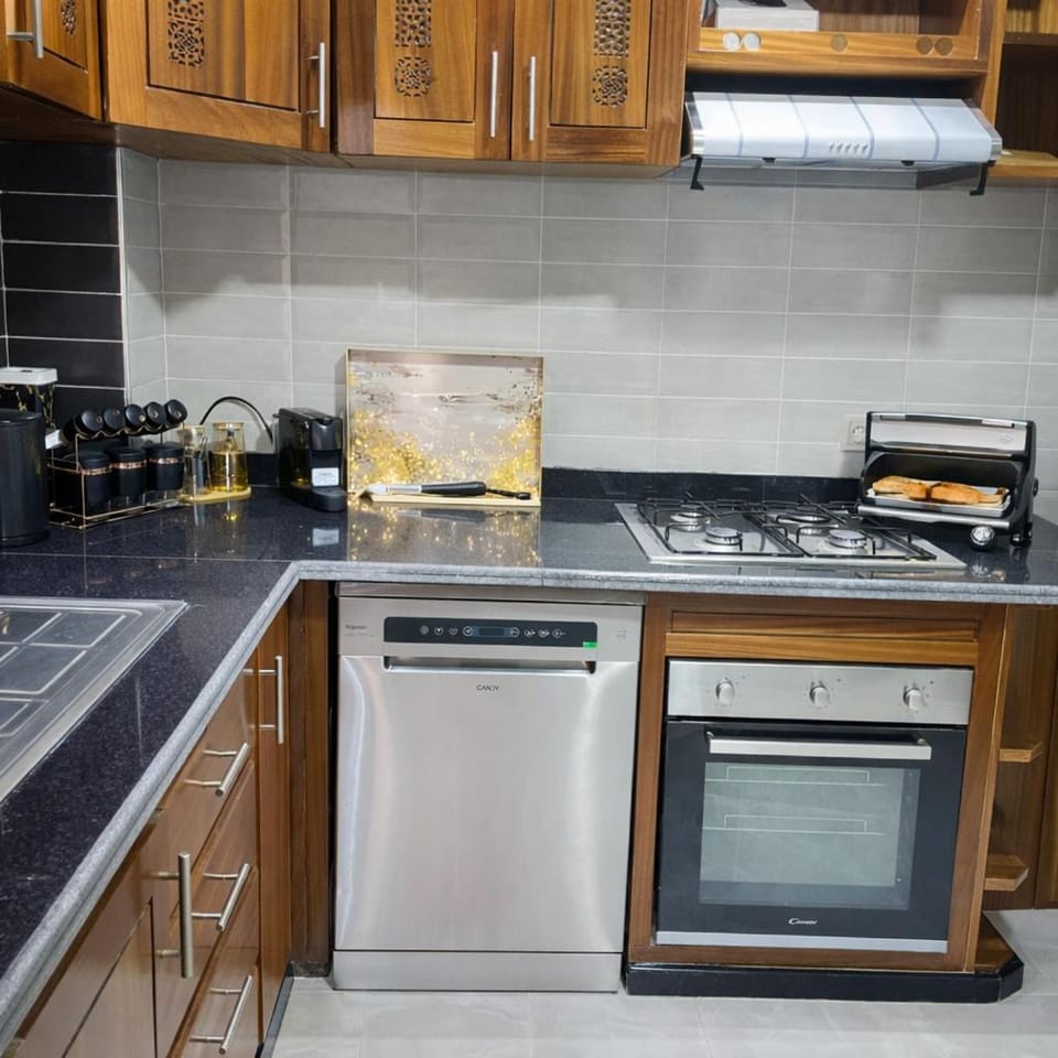 Kitchen or kitchenette, dishwasher, oven, stove, toaster