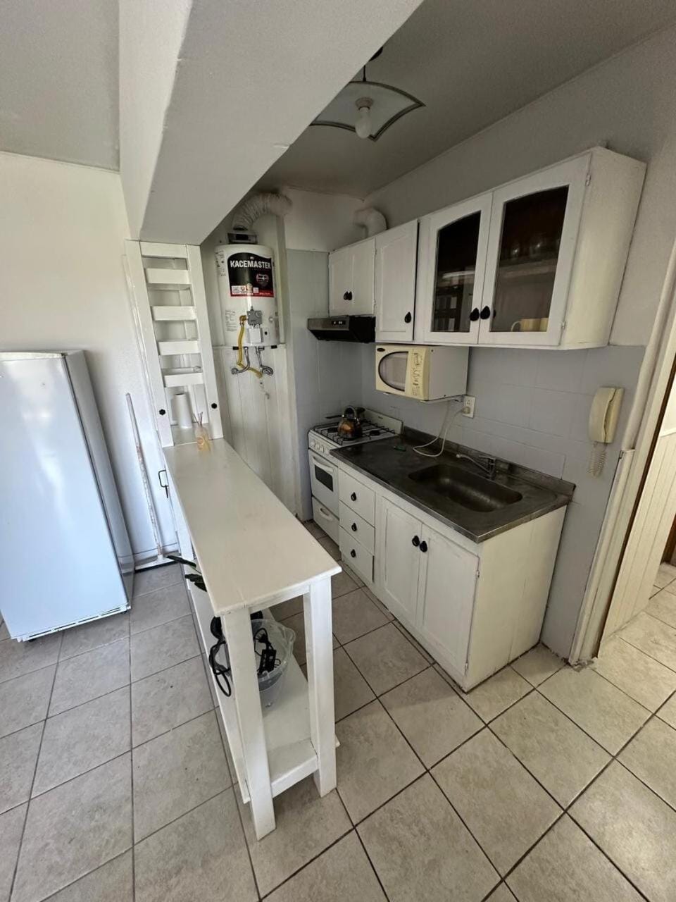 Kitchen or kitchenette, oven, stove