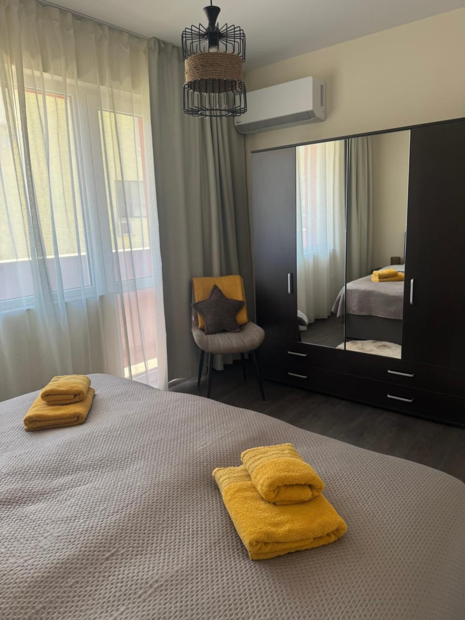 Bed, Seating area, Bedroom, towels, wardrobe, air conditioner