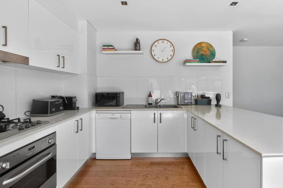 Kitchen or kitchenette, dishwasher, oven, stove, toaster