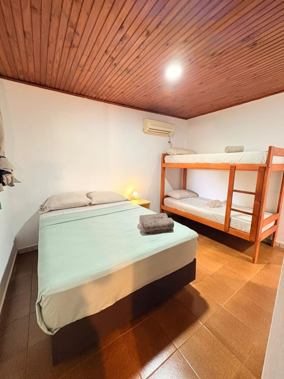 Bed, Photo of the whole room, Bedroom, bunk bed, towels, air conditioner