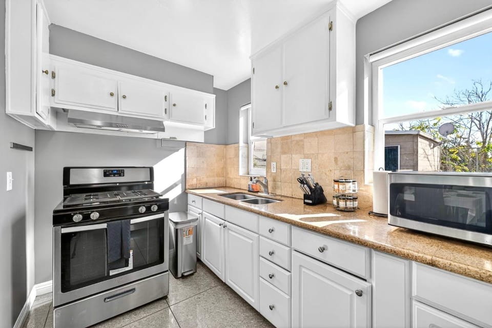 Kitchen or kitchenette, microwave, storage, stove
